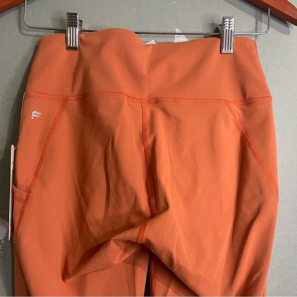 NWT Fabletics High Waisted Side Pocket 7/8 Leggings in Rust Orange - Picture 6 of 6